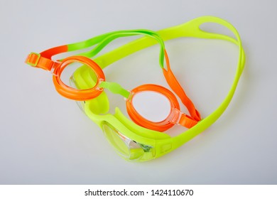 Professional Glasses For Swimming Isolated On A White Background. Kid's And Adult Pool Goggles.