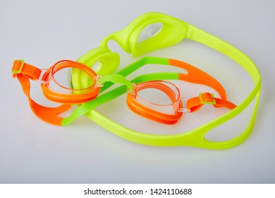 Professional Glasses For Swimming Isolated On A White Background. Kid's And Adult Pool Goggles.