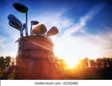 Professional golf gear on the golf course at sunset.