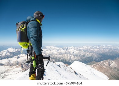 Professional guide - climber on the snow-covered summit of Elbrus sleeping volcano - Powered by Shutterstock