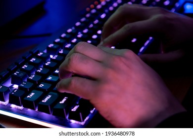 Professional guy typing on his keyboard and playing some game - Shutterstock ID 1936480978