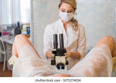 Professional Gynecologist Examining Her Female Patient On A Gynecological Chair. 