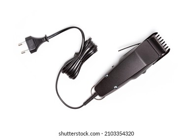 Professional hair clipper isolated on white background. Top view of the electric black hair clipper, closeup