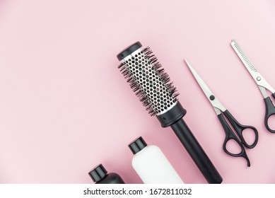 Professional Hair Dresser Tools With Copy Space On Trendy Pink Background. Hair Stylist Equipment Set. Scissors, Brush, Hairbrush, Balm Flat Lay Top View.