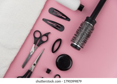 Professional Hair Dresser Tools With Copy Space. Hair Stylist Equipment Set On Pink Background. Scissors, Brush, Hairbrush, Balm Flat Lay Top View.