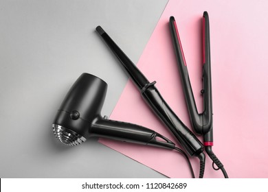 Professional hairdresser's equipment on color background