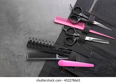 Professional Hairdressing Equipment In Black Case On Grey Background