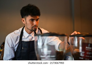 Professional And Handsome Asian Male Barista Or Coffee Shop Owner Brewing A Cup Of Coffee With The Machine. Coffee Shop Business Concept