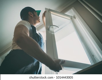 Professional Handyman Installing Window At Home.