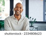 professional headshots, cheerful dark skinned man with myasthenia gravis disease looking at camera, happy office worker with eye syndrome, inclusion and diversity