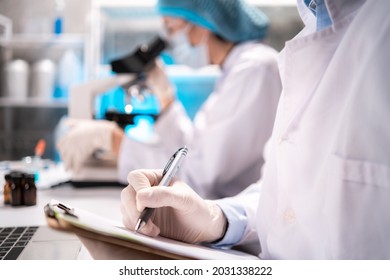 professional health care researchers scientist working in life of medical science laboratory, scientific technology of medicine chemistry or biology lap experiment test work for doctor in hospital - Shutterstock ID 2031338222