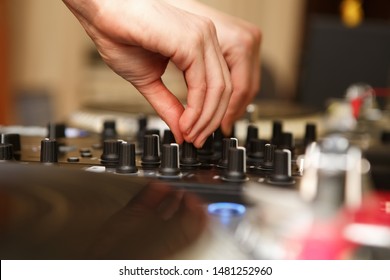 Professional Hip Hop Dj Mixes Tracks On Sound Mixer Controller In Night Club.Female Disc Jockey Playing Tracks On Party.Audio Equipment For Playing Music In High Quality