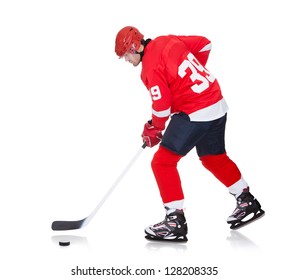 Professional Hockey Player Skating On Ice. Isolated On White