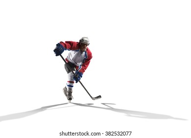 Professional hockey player skating on ice. Isolated on white