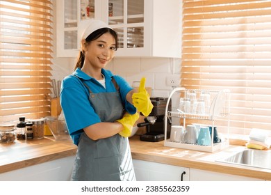 Professional housekeeper female services company team working at customer house washing dishes, laundry, kitchen cleaning, maid worker in small business partnership working together household task - Shutterstock ID 2385562359
