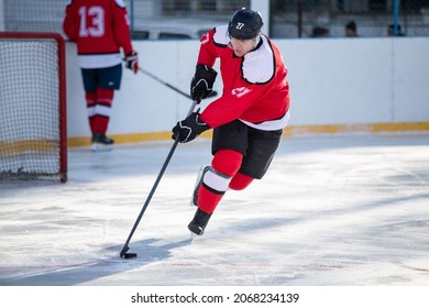 Professional ice hockey player in attack on the rink.
