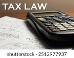 A professional image depicting tax law, with a gavel, tax forms, and a calculator on a desk. Ideal for content related to legal tax services, IRS, audits, and financial regulations.