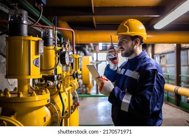 Professional Industrial Worker Checking Pressure Of Natural Gas Pipeline Inside Power Plant Or Refinery.