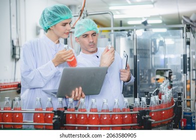 Professional Inspection Control Scientist In Uniform Are Working For Fruit Juice Production Industry In Food Manufacturing Factory, Water Drink Checking And Beverage Research In Laboratory