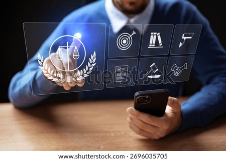 Professional interacting with digital interface while using smartphone in office setting