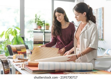 Professional interior designers and decorator checking different types of wallpaper, home renovation and creativity concept - Powered by Shutterstock