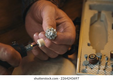Professional jeweler working with gemstones at table, above view - Shutterstock ID 2264243697