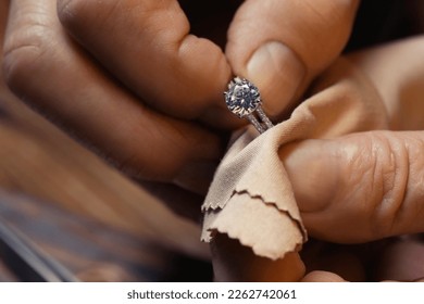 Professional jeweler working with ring, closeup view - Powered by Shutterstock