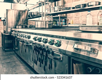 Professional kitchen interior, crock on stove, toned image