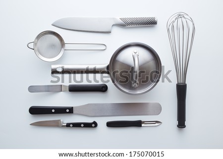 Professional kitchen utensils on white background overlook shot