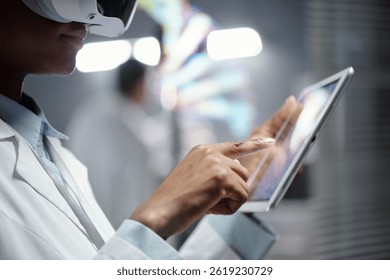 Professional in laboratory setting using virtual reality headset and tablet for advanced research and analysis. Innovative technology applications enhancing scientific study