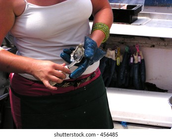 A Professional Lady Oyster Shucker