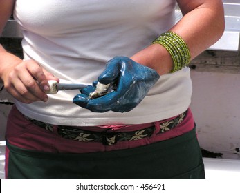 A Professional Lady Oyster Shucker