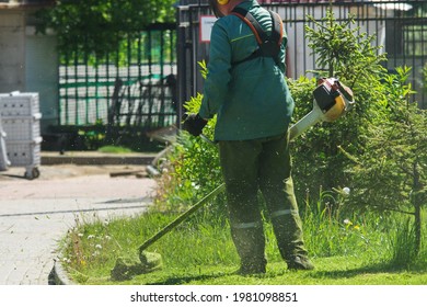 Professional Lawn Mowing With A Trimmer