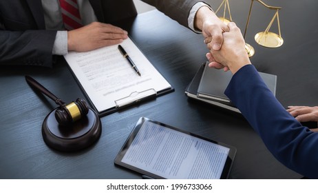 Professional lawyer advising a client on commercial contract legal in service office. Justice, Law, Attorney and Court judge concept.