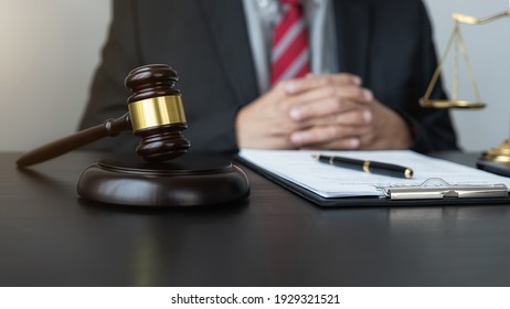 Professional Lawyer Considering With Contract Papers In Courtroom. Justice, Law, Attorney And Court Judge Concept.