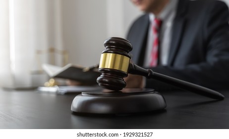 Professional lawyer considering with contract papers in courtroom. Justice, Law, Attorney and Court judge concept.