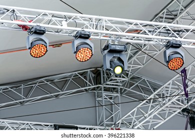 professional lighting equipment under roof of outdoor stage 