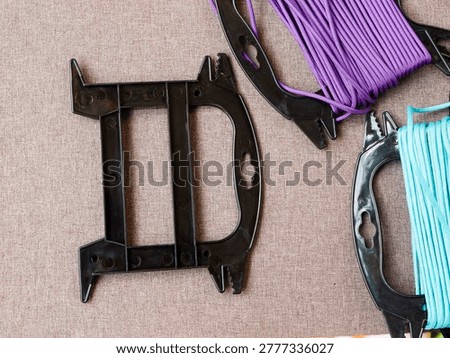 Professional line management tools featuring durable plastic winders and colorful parachute cord for survival and outdoor gear.