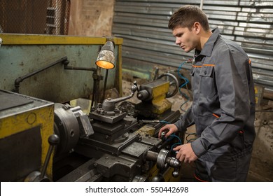 Professional machinist. Horizontal shot of a man operating lathe grinding machine metalworking industry concept copyspace 