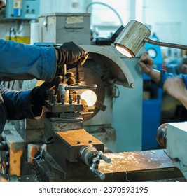 Professional machinist : man operating lathe grinding machine - metalworking industry concept. Mechanical Engineering control lathe machine in factory. - Powered by Shutterstock