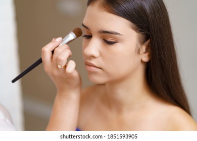 Professional makeup artist working with client in dressing room - Shutterstock ID 1851593905