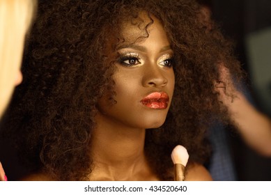 Professional Makeup With A Beautiful Young Black Woman Having Touches Applied To Her Make Up By Beautician