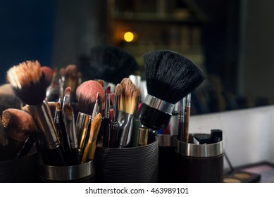 Professional Makeup Brushes Set Closeup Near Salon Mirror