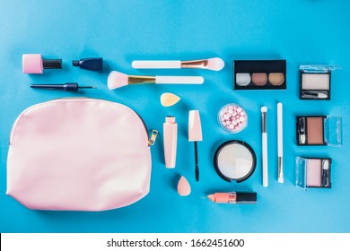 Professional Makeup Cosmetic Set, With Summer Tropical Leaves, Woman Bag. Make Up Items. Luxury Decorative Cosmetics Flatlay, Top View, Mockup. Beauty Blogger Concept. Trendy Turquoise Background