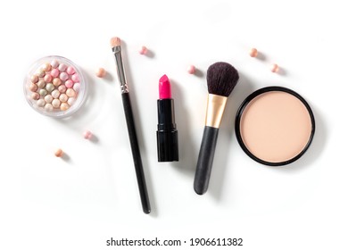 Professional makeup on a white background. Brushes, lipstick and other products, a flat lay