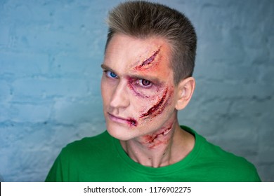 Professional make-up of young man with horrible scars
