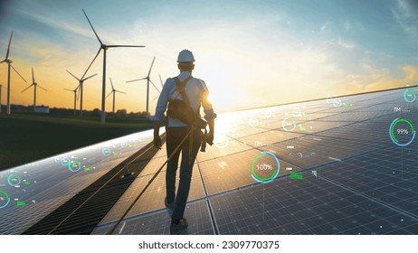 Professional Male Maintenance Engineer Walking On Solar Panel in Sustainable Resources Farm With Wind Turbines. Following Shot of Expert Inspecting Hardware. VFX Infographics Shows Statistics, Data. - Powered by Shutterstock
