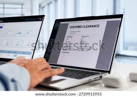 Professional Man Completing Import Export Clearance Form On Laptop Computer