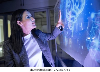A professional man interacts with a high-tech circular data interface on a large digital screen, featuring graphs and data elements in a glowing blue theme. - Powered by Shutterstock - Get 15% off with code: PIKWIZARD15
