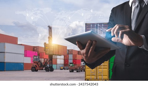 A professional man uses a tablet to manage and track shipping containers, with a futuristic global logistics network overlay.

 - Powered by Shutterstock